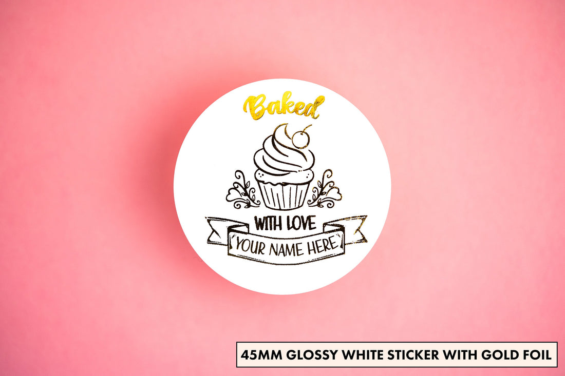 Add a touch of sweetness with our bakery sticker! Featuring a charming cupcake, 'Baked with Love' wrapped around it and a customizable banner for your bakery name—all embossed in elegant gold. Perfect for boosting your business's visibility!