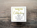 Custom square sticker with "Thank You For Celebrating with Us" written on the middle of the sticker. At the bottom of the sticker is the name of the bride & groom and the date of their special day. The sticker is layered with lovely metallic foil