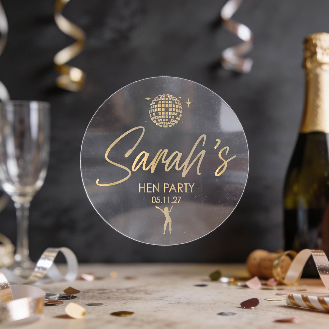 Personalised transparent sticker with 'Sarah's Hen Party' written in gold foil text. 