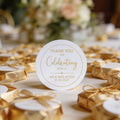 Round gloss sticker with gold foil text saying, 