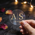 Transparent round stickers with gold foil printed monogram initials in the centre and date at the bottom