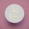 A round sticker with 'It's a Boy' and the name 'Emma's Baby Shower' foil stamped in gold.