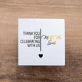 Personalised square metallic foil stickers with "Thank you for celebrating with us" and the name of the lovely couple in the middle. The words are separated by a line and a heart finishing off the design at the bottom.