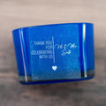 Frosted clear with lovely print with the message "Thank you for celebrating with us" and the name of the happy couple in a lovely curvy font. A line separates the words in the middle and a heart finishes the sticker off. Printed using white ink.