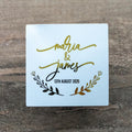 A gloss white square sticker with 
