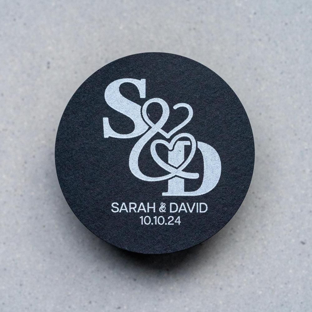 A black monogram sticker printed using white ink, the initials of the happy couple sit in the middle. The names and wedding date finish the sticker off at the bottom.