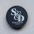 A black monogram sticker printed using white ink, the initials of the happy couple sit in the middle. The names and wedding date finish the sticker off at the bottom.