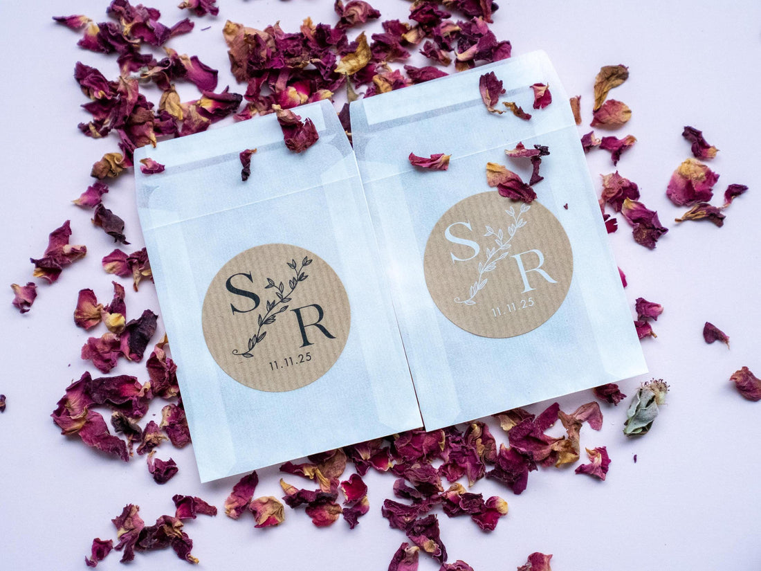 A brown kraft sticker with monogram letters in the middle, separated by a leaf line. The date finishes the sticker at the bottom. The print come in two colours: black and white.