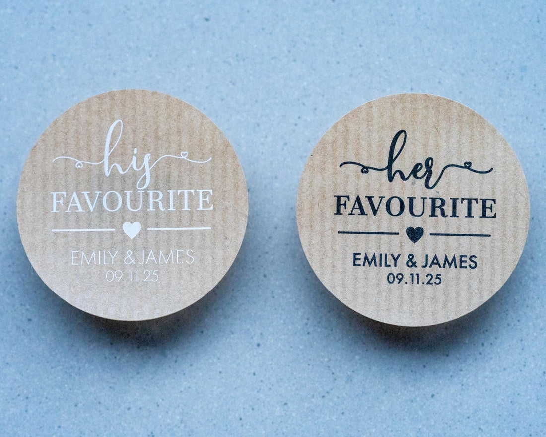 Custom brown kraft stickers in a choice of white and black ink. On the stickers are written His or Her Favourite and the name of the married couple on the bottom. The sticker is finished with the wedding date.