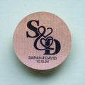 Kraft stickers with the initials of the happy couple in the centre of the stickers. Name and date sits beneath in a choice of white and black ink print.