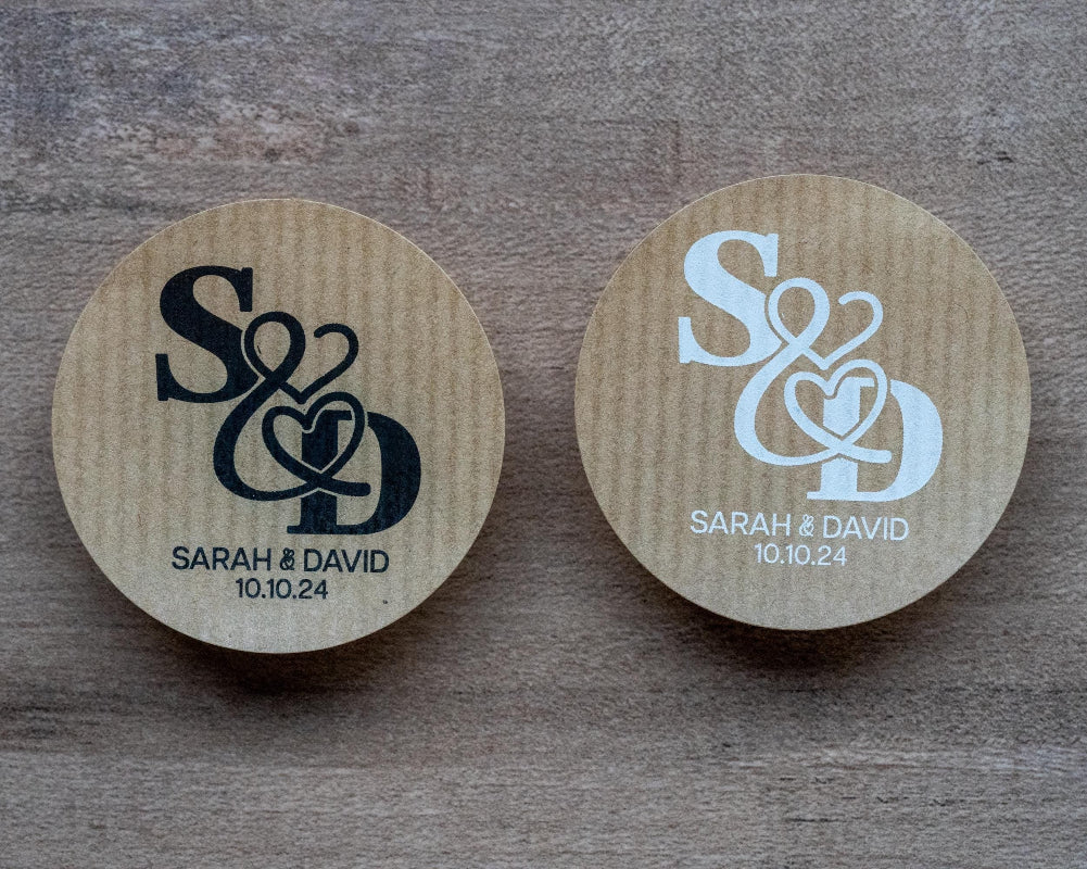 Kraft stickers with the initials of the happy couple in the centre of the stickers. Name and date sits beneath in a choice of white and black ink print.