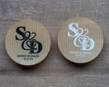 Kraft stickers with the initials of the happy couple in the centre of the stickers. Name and date sits beneath in a choice of white and black ink print.
