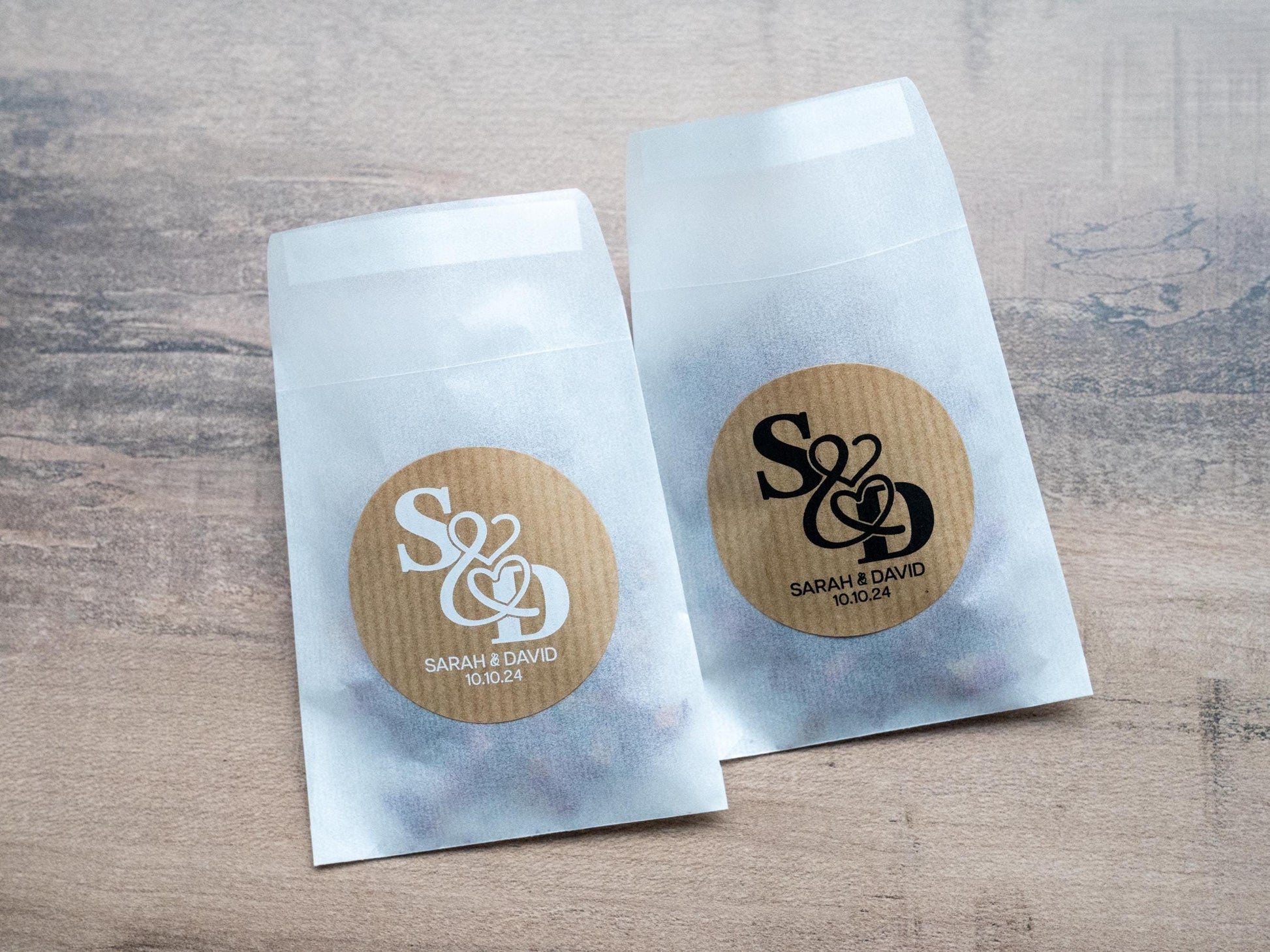 Kraft stickers with the initials of the happy couple in the centre of the stickers. Name and date sits beneath in a choice of white and black ink print.