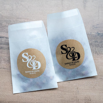 Kraft stickers with the initials of the happy couple in the centre of the stickers. Name and date sits beneath in a choice of white and black ink print.