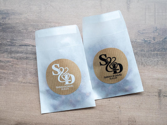 Kraft stickers with the initials of the happy couple in the centre of the stickers. Name and date sits beneath in a choice of white and black ink print.