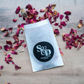 A black monogram sticker printed using white ink, the initials of the happy couple sit in the middle. The names and wedding date finish the sticker off at the bottom.
