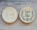 Two custom kraft wedding stickers featuring leaf patterns and personalised text 'Sara & Adam'. 