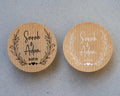 Two kraft wedding stickers featuring leaf patterns and personalised text 'Sara & Adam'. 